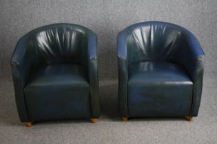 A matching pair of leather tub armchairs. H.75cm. (One leg in need of repair as seen).