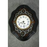 A Napoleon III French ox-eye clock with mother of pearl inlay. Each of white enamel bubbles with a