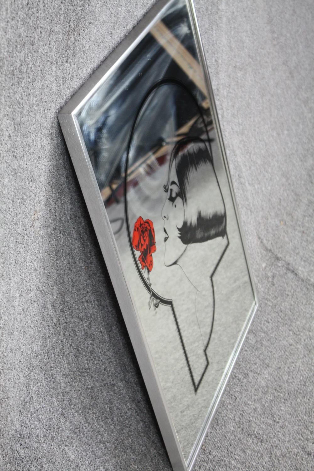 Advertising mirror decorated with an Art Deco print of a woman with a rose. H.77 W.51cm. - Image 2 of 4