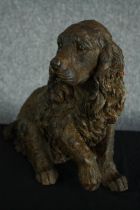 A Spaniel figure. Poly-resin with a bronze powder finish. H.40cm.
