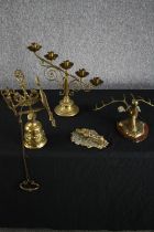 A mixed collection of brassware including a candle holder, knocker and stags head. H.37cm. (largest)