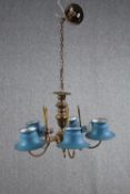 A five branch brass chandelier with light blue toleware shades. H.34 Dia.55cm.