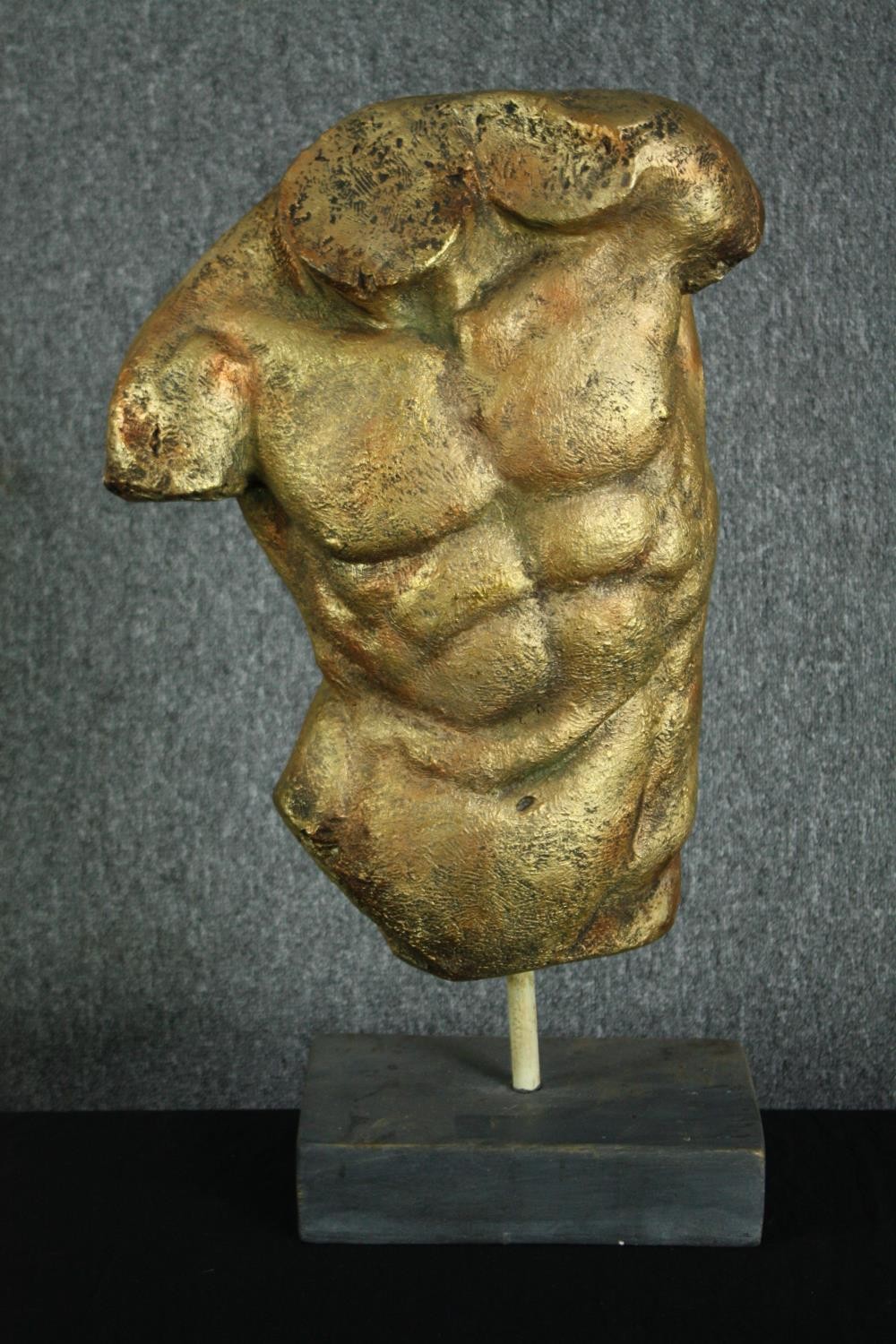 A modern fibreglass classical torso in a gold finish. H.67cm.