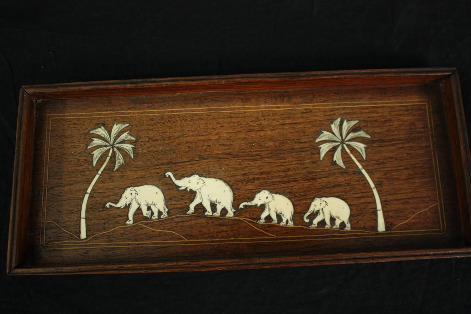 An elephant collection, including ebony carved elephants, a wooden tray decorated with bone - Image 2 of 10