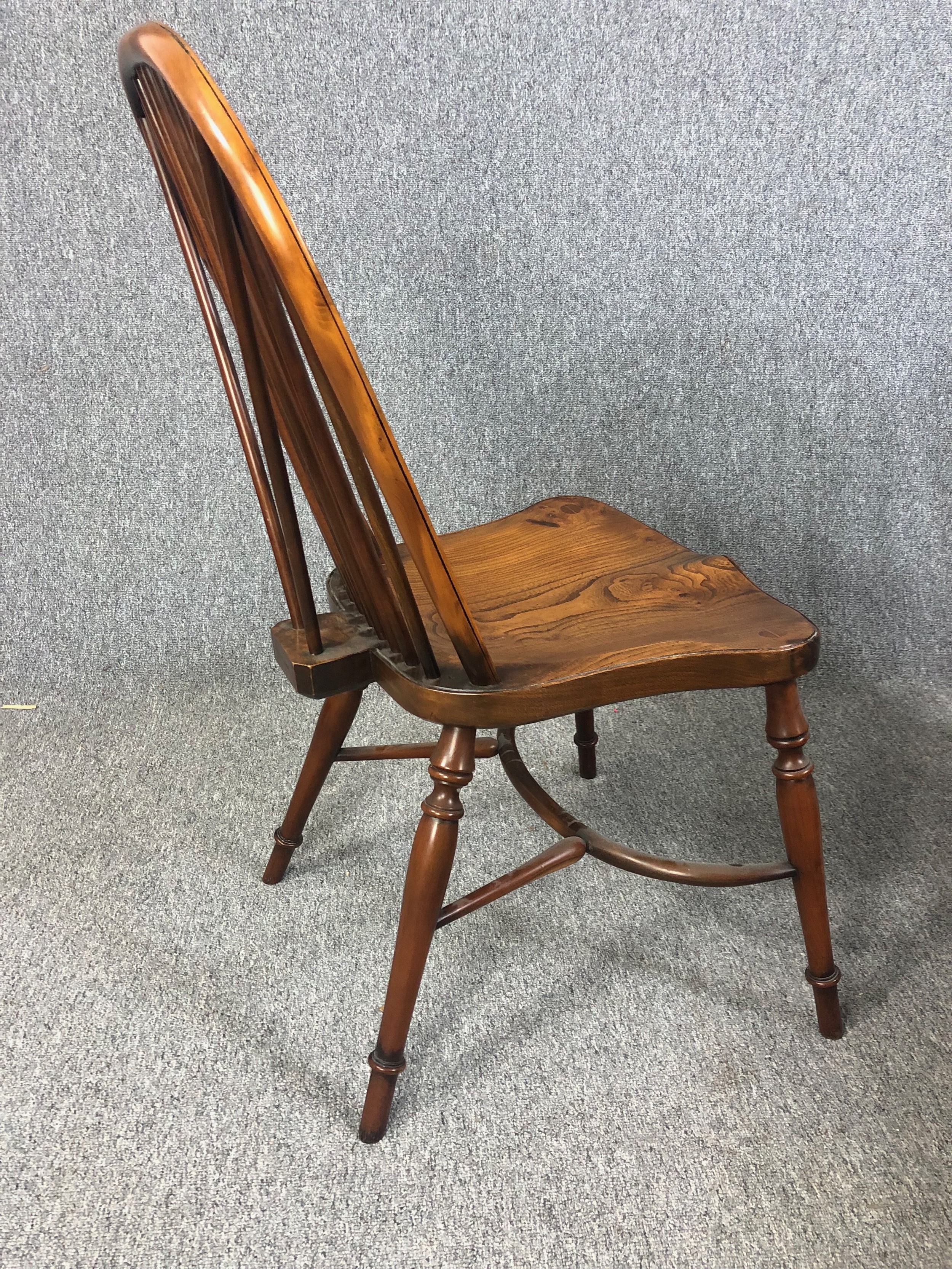 Dining chairs, a set of eight Windsor stick back style in yew with elm saddle seats on crinoline - Image 5 of 12