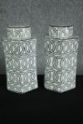 A pair of black and white lidded ginger jars decorated with chainlink pattern. H.31cm. (each)