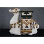 A modern oriental style ceramic Camel garden stool. Hand painted and well detailed. H.49cm.