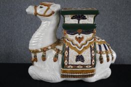 A modern oriental style ceramic Camel garden stool. Hand painted and well detailed. H.49cm.