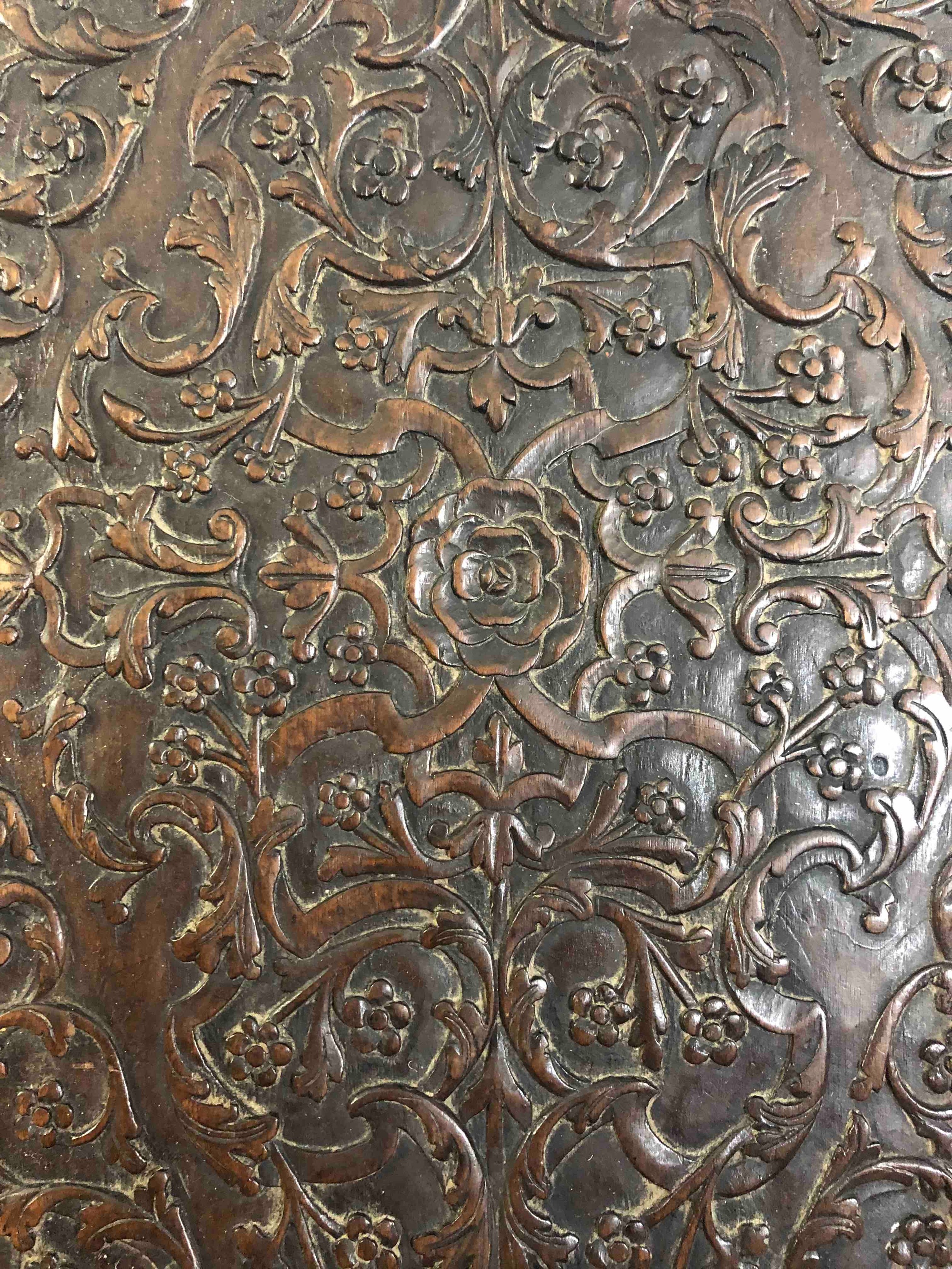 An 18th century oak cupboard base profusely carved allover with scrolling foliate motifs. H.41 W. - Image 6 of 11