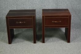 A pair of contemporary bedside cabinets covered in stitched leather. H.53 W.50 D.44cm.