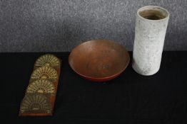 An early 20th century heavy copper and red enamel fruit bowl along with a textured glaze cylindrical