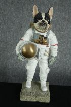 'Cosmic canine explorer'. A dog figure dressed as an astronaut. H.39cm.