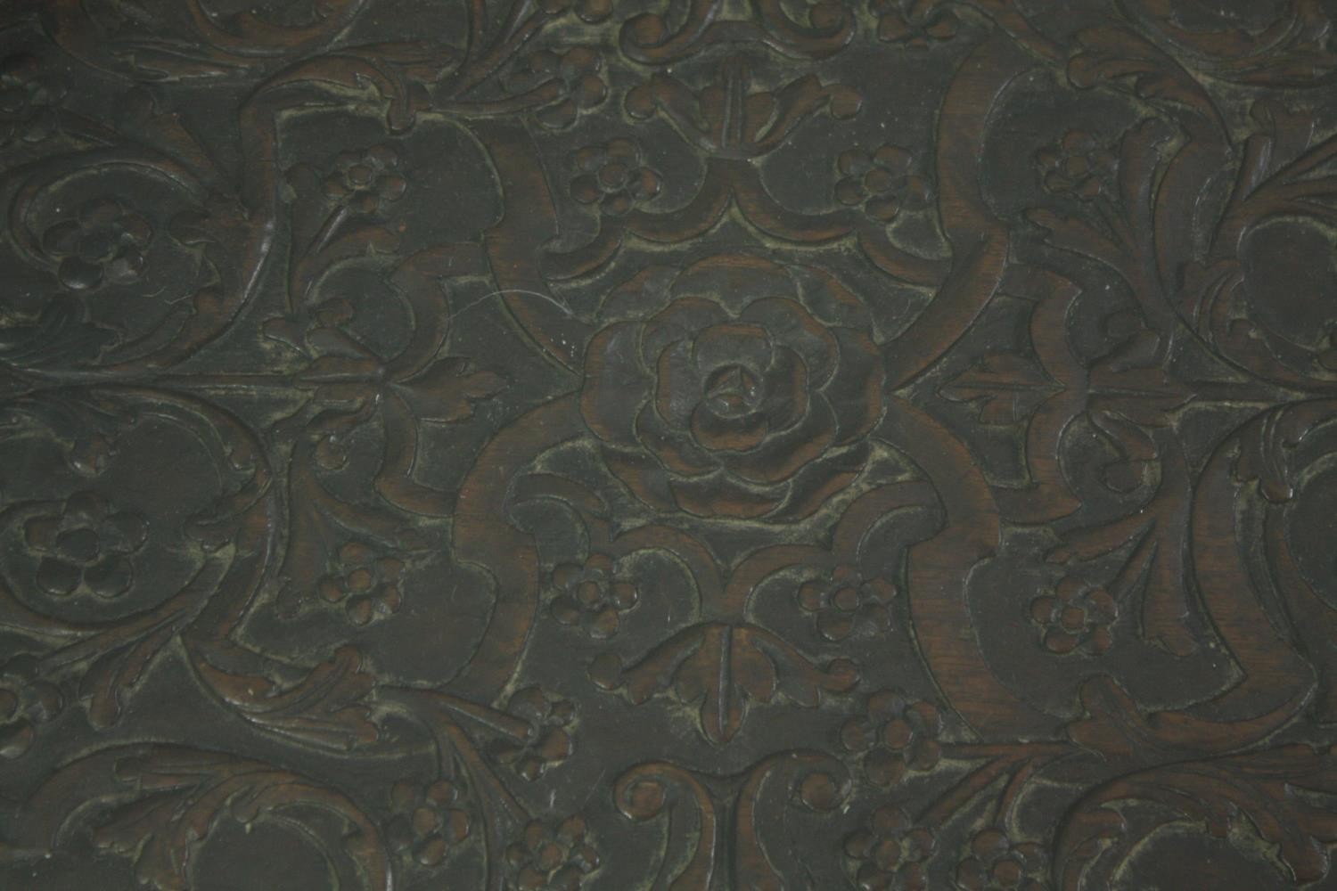 An 18th century oak cupboard base profusely carved allover with scrolling foliate motifs. H.41 W. - Image 9 of 11