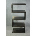 A contemporary teak and chrome display stand. H.133 W.60 D.45cm. (Some veneer lifting but present as