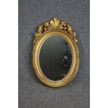 Wall mirror, 19th century gilt with Rococo shell carved cresting. H.68 W.46cm.