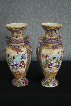 Two Japanese satsuma vases. Glazed ceramics with highly detailed raised figural decoration.