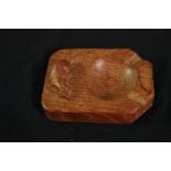 A Robert Thompson of Kilburn "Mouseman" oak ashtray carved with signature mouse. L.10 W.7.5cm.