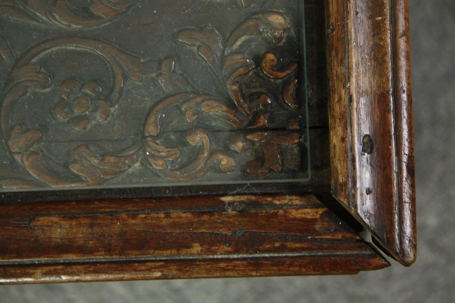 An 18th century oak cupboard base profusely carved allover with scrolling foliate motifs. H.41 W. - Image 11 of 11