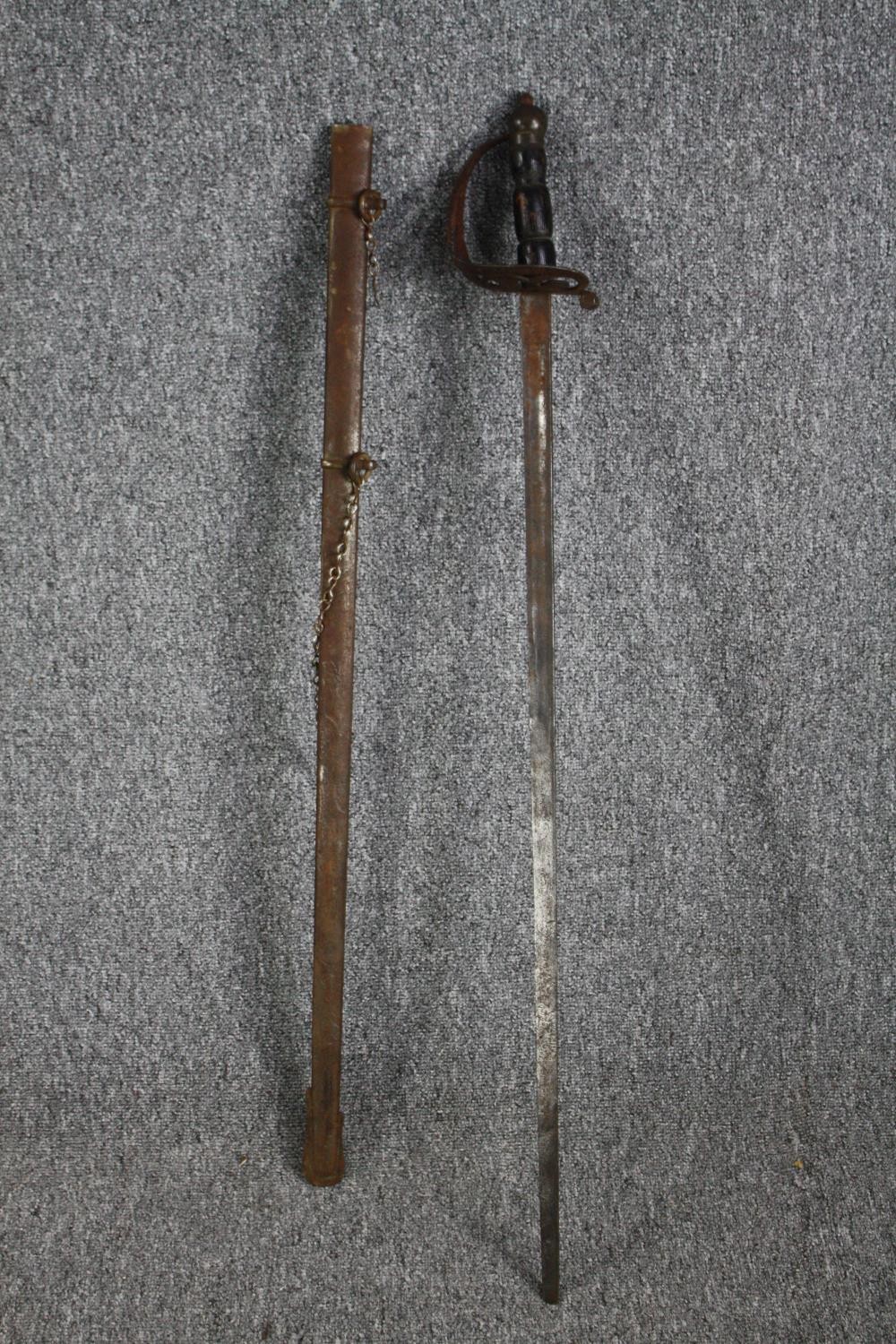 A sword and scabbard. Quite rusted and without a visible maker's mark. With a wooden handle and - Image 2 of 7