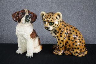 A hand painted ceramic puppy together with a leopard cub. H.36cm. (largest)