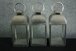 Three steel storm lanterns for candles. H.45cm. (each)