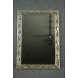 Wall mirror, contemporary silvered foliate frame with bevelled plate. H.107 W.76cm.