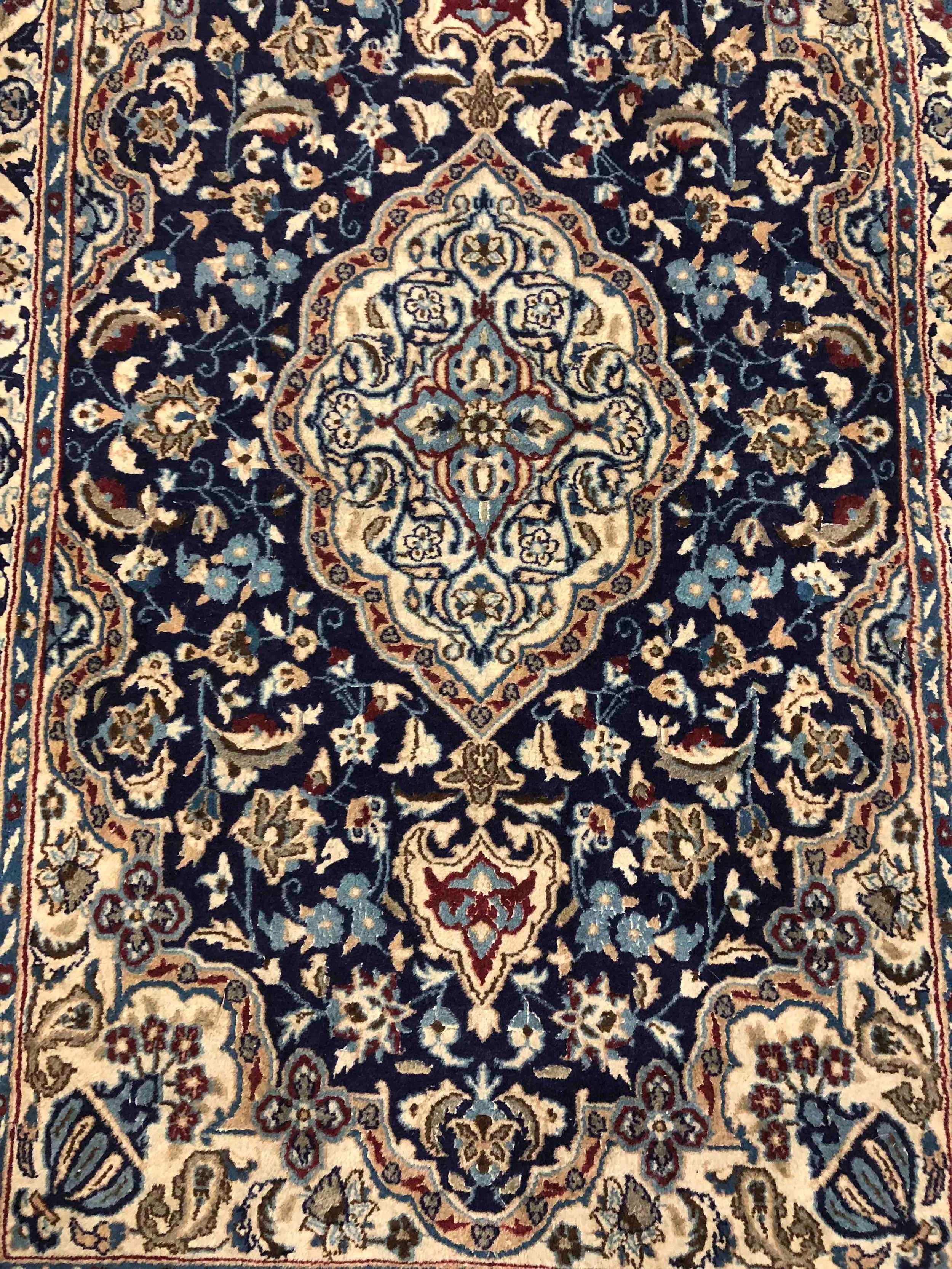 Carpet, Kashan with central medallion on a midnight ground within foliate spandrels and multiple - Image 2 of 3