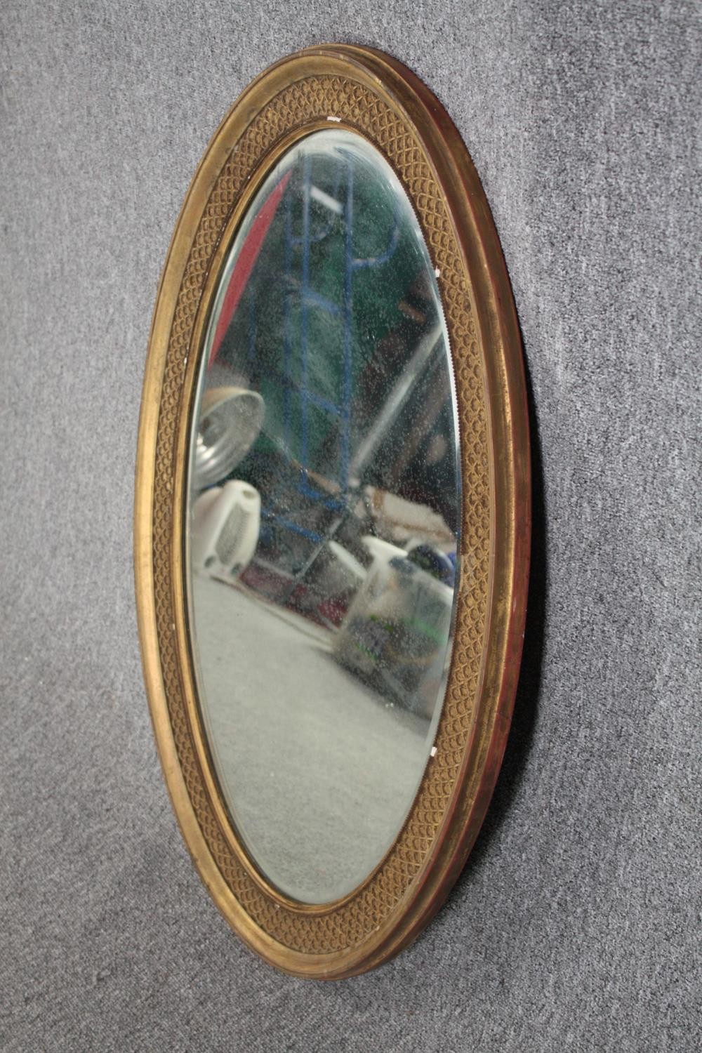 A C.1900 gilt framed mirror with bevelled plate. H.96 W.66cm. - Image 2 of 4