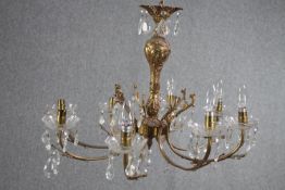 A French foliate design chandelier with seven branches and crystal drop detailing. H.54 Dia.68cm.