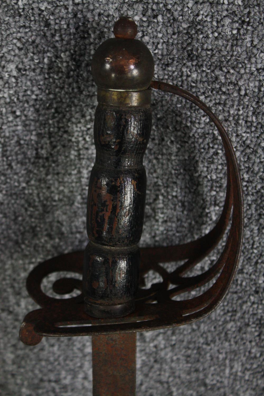 A sword and scabbard. Quite rusted and without a visible maker's mark. With a wooden handle and - Image 4 of 7