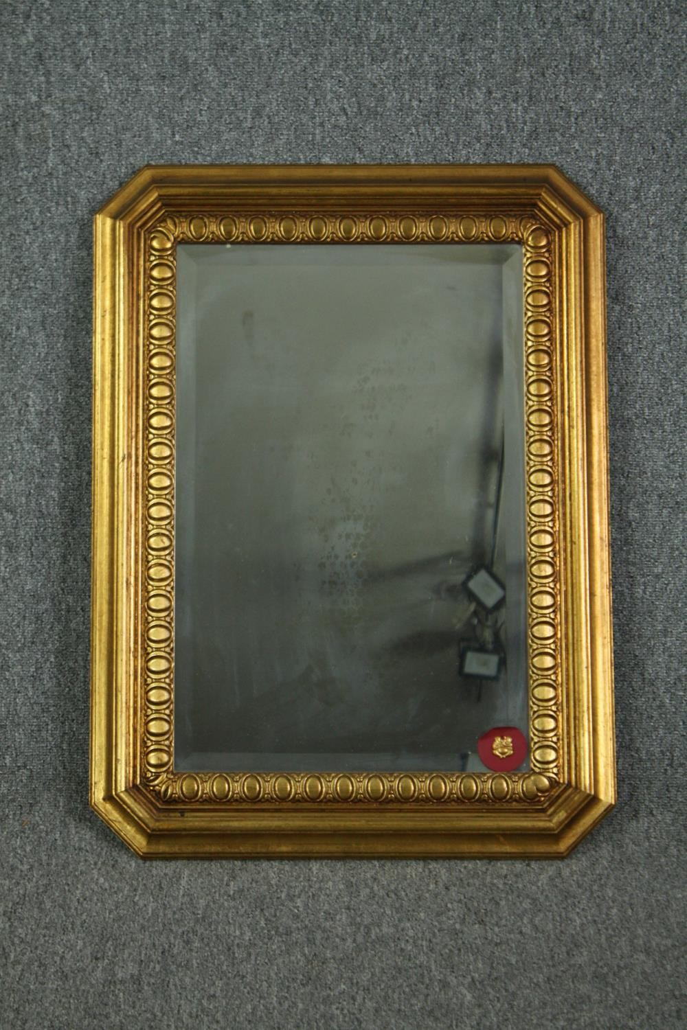 Wall mirror, contemporary gilt framed with bevelled plate. H.78 W.57cm.