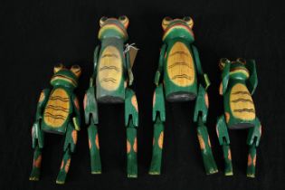 Four carved and hand painted frog puppets. H.36cm. (largest)