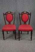 Chairs, a pair, late 19th century amboyna and ebonised with hand painted porcelain medaillon to