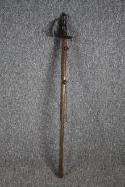 A sword and scabbard. Quite rusted and without a visible maker's mark. With a wooden handle and