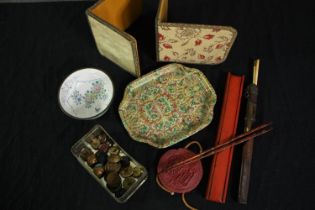 Miscellaneous. Bookends, military buttons, chop sticks, a seal and a bowl. L.26cm. (largest)