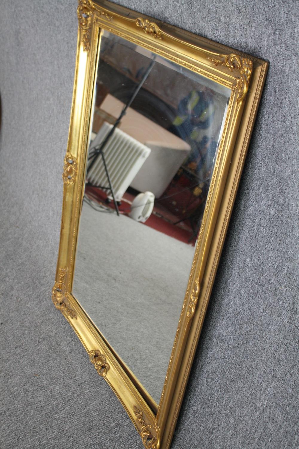 A gilt framed mirror with bevelled plate. H.106 W.75cm. - Image 3 of 4