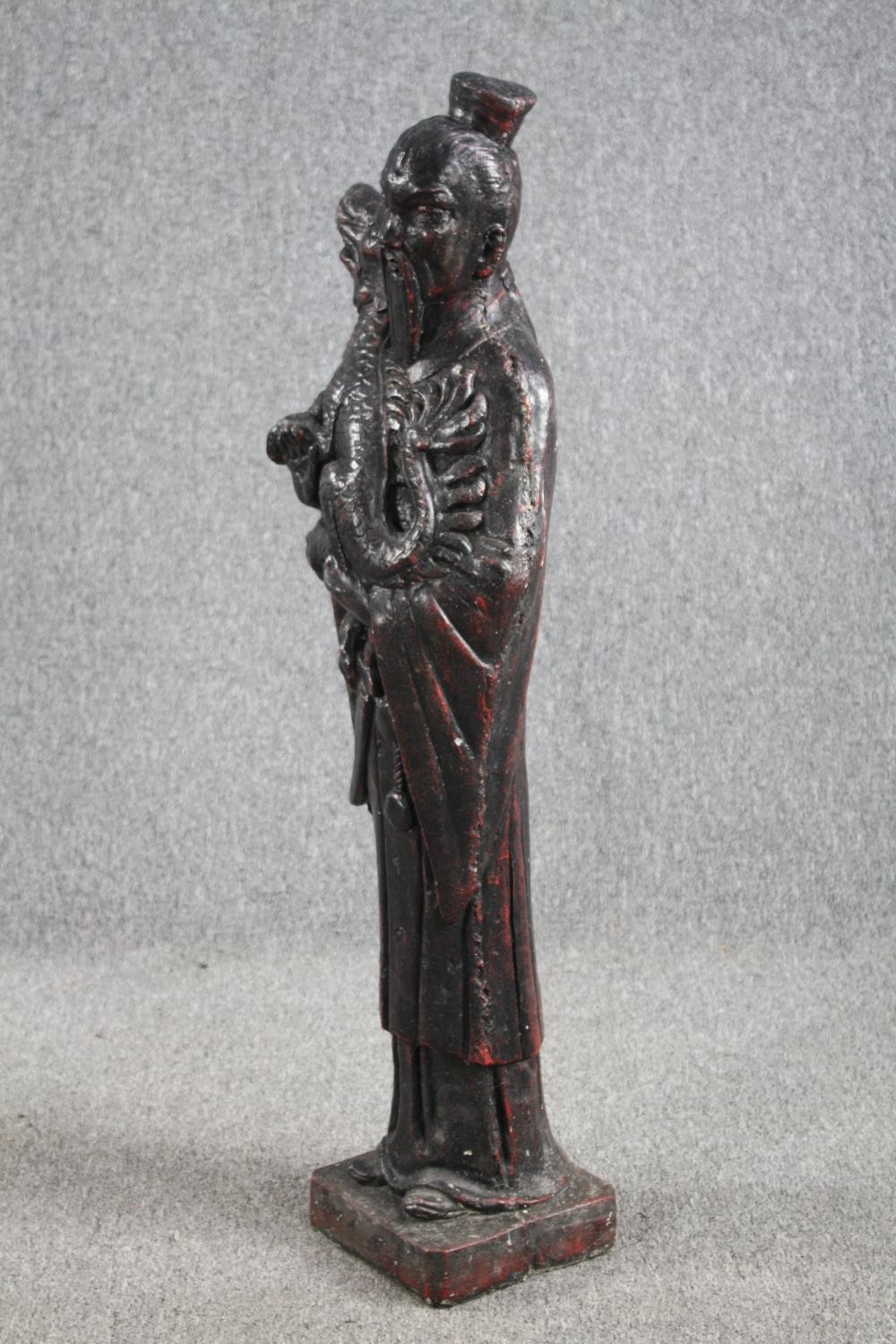 A large figurine. A Chinese man holding a Foo dog. Concrete painted in a bronze like patina. Very - Image 2 of 5