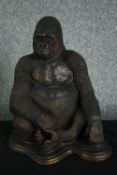 A large moulded figure. A gorilla finished in a distressed bronze type patina. H.40cm.