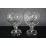 A pair of cut glass lamps. H.27cm (each)