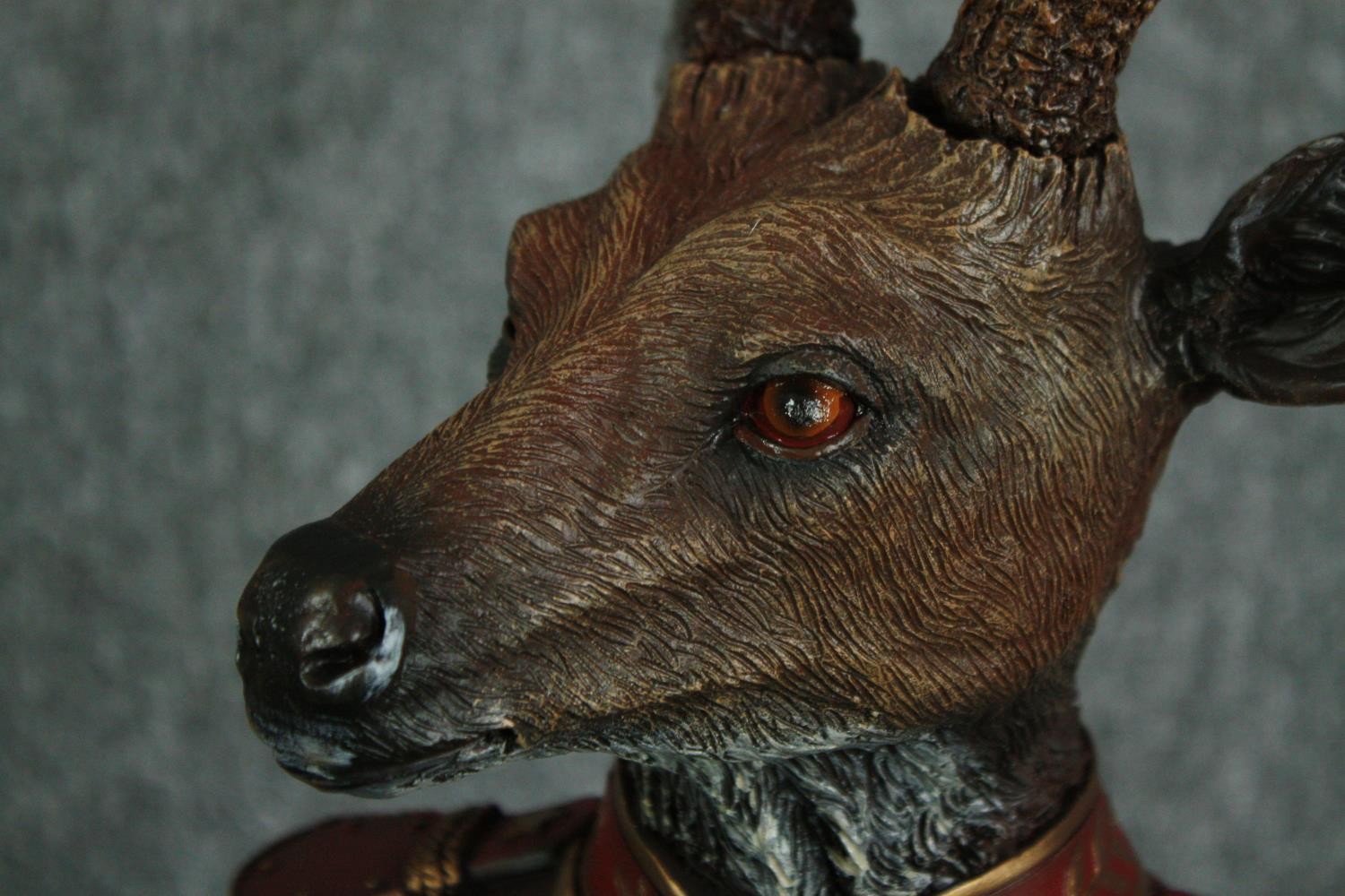 A horned stag bust in Napoleonic uniform. Poly-resin and hand painted. H.42cm.H.48cm. - Image 3 of 3
