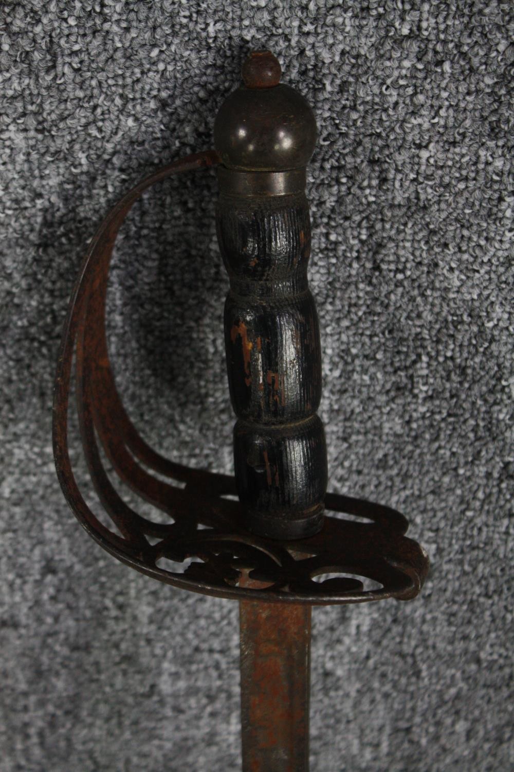 A sword and scabbard. Quite rusted and without a visible maker's mark. With a wooden handle and - Image 3 of 7