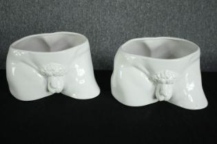 Two ceramic planters. In the form of two sections of a classical statue. H.19 W.28 D.21cm. (each)