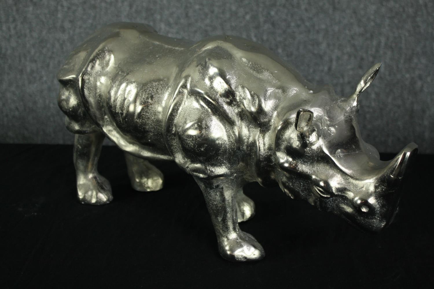 An aluminium cast rhino figure. Lightly polished. H.25 W.50cm. - Image 2 of 3