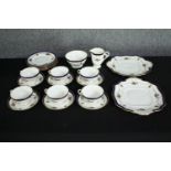 An early twentieth century Adelaide bone china tea set. Made up of six cups and saucers, six side