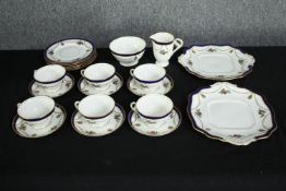 An early twentieth century Adelaide bone china tea set. Made up of six cups and saucers, six side