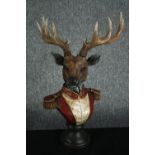 A horned stag bust in Napoleonic uniform. Poly-resin and hand painted. H.42cm.H.48cm.