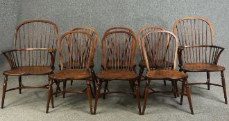 Dining chairs, a set of eight Windsor stick back style in yew with elm saddle seats on crinoline