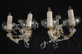A pair of early 20th century glass wall lights each with two branches and cane glass design. H.25cm.