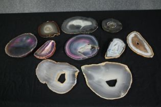 A collection of nine agate geode slices, some dyed. L.23cm. (largest)
