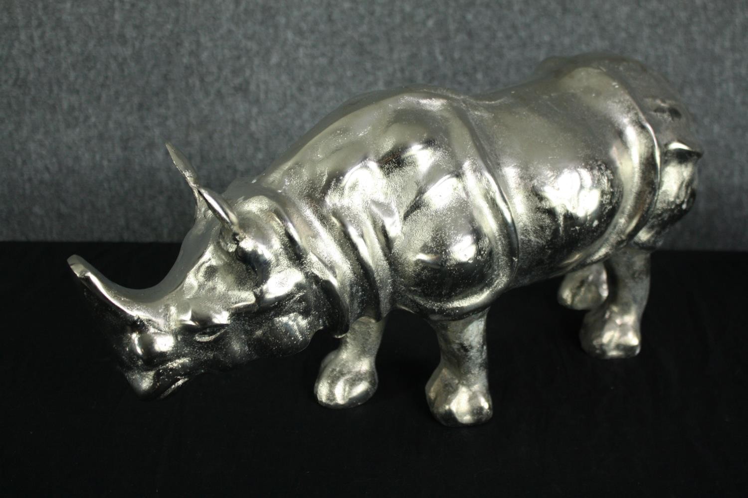 An aluminium cast rhino figure. Lightly polished. H.25 W.50cm. - Image 3 of 3